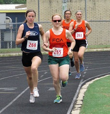 a few runners running on the track